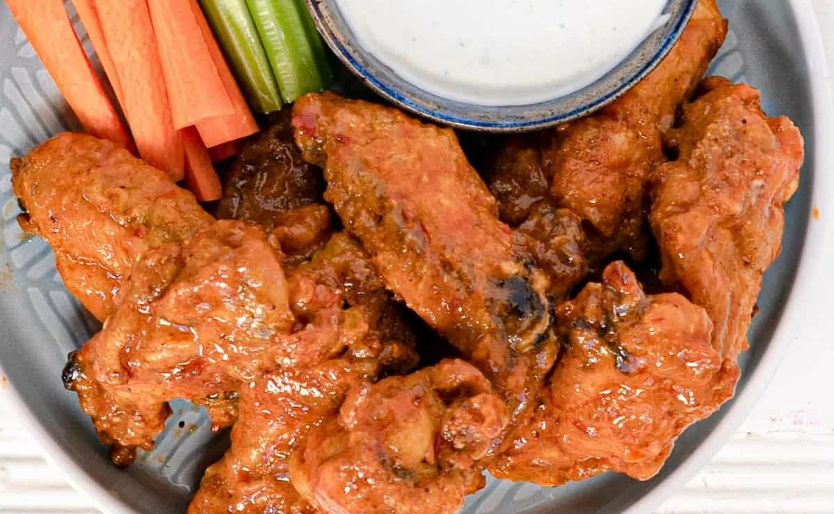 Baked Chicken Wings with Buffalo Sauce and Celery Sticks jpg